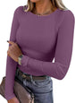 LUXEHAEVEN ANRABESS women wearing a purple long sleeve ribbed fitted top with jeans and a handbag.